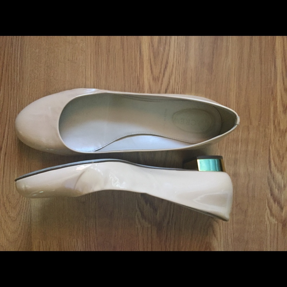 J Crew patent leather flats with gold heels.